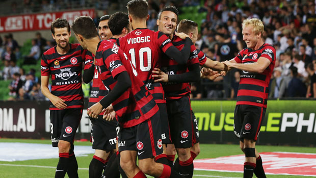 Wanderers players celebrate a goal in their 3-0 win over Melbourne City.